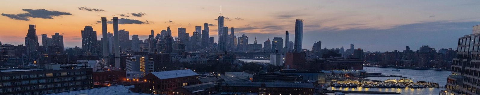 Brooklyn Navy Yard and Manhattan skyline at dusk